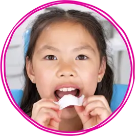 photo-3-up-pink-circle-girl-putting-in-palatal-expander